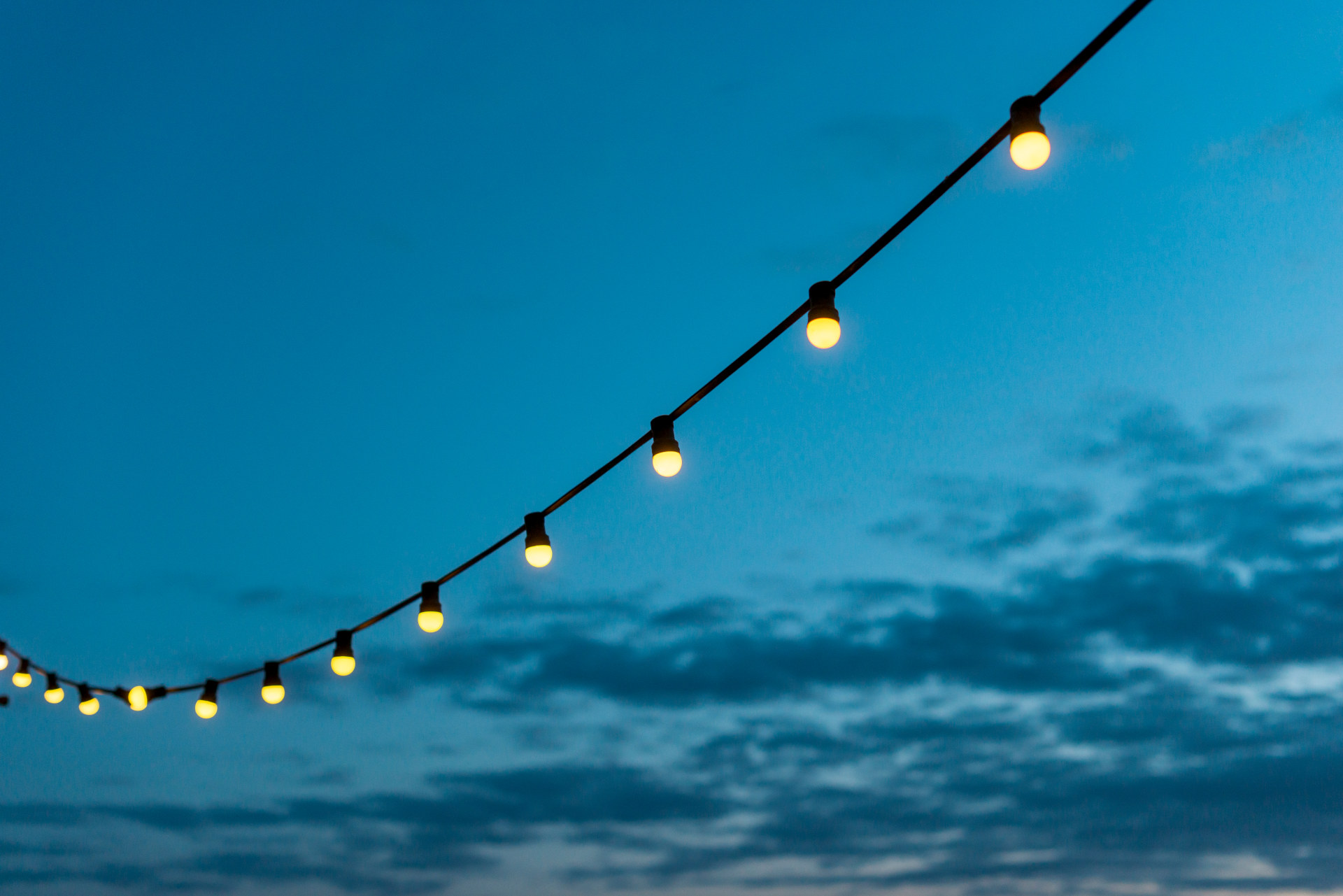 string lights with sunset sky
